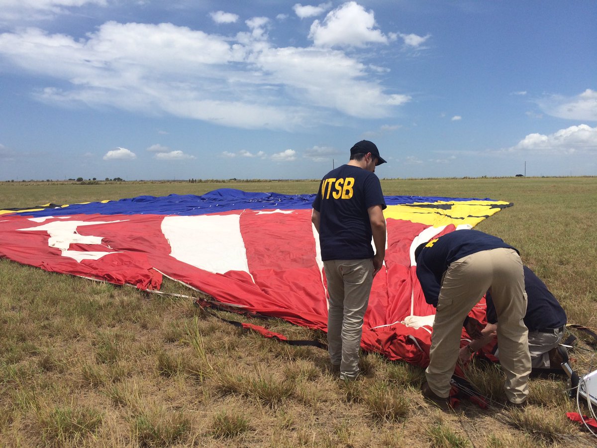 NTSB officials examine the balloon's envelope, 31 July 2016; Credit: NTSB